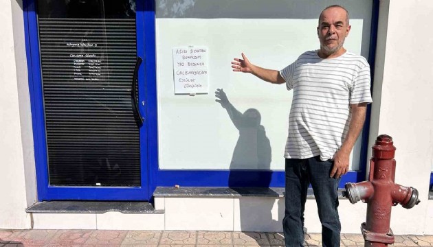 Aşırı sıcaktan bunalan esnaf dükkanı kapattı